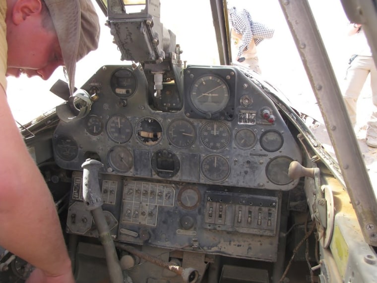 The plane's cockpit is in remarkable though dusty condition.