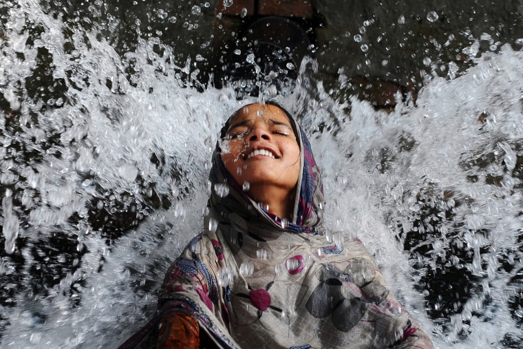 A splash of relief during heat wave in Pakistan