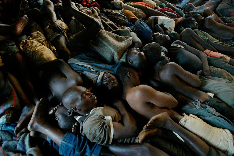 Malawi: Blantyre: June 29, 2005: At a prison in Malawi, inmates sleep on the floor, so tightly packed that they turn only when a designated prisoner wakes them to do so en masse.