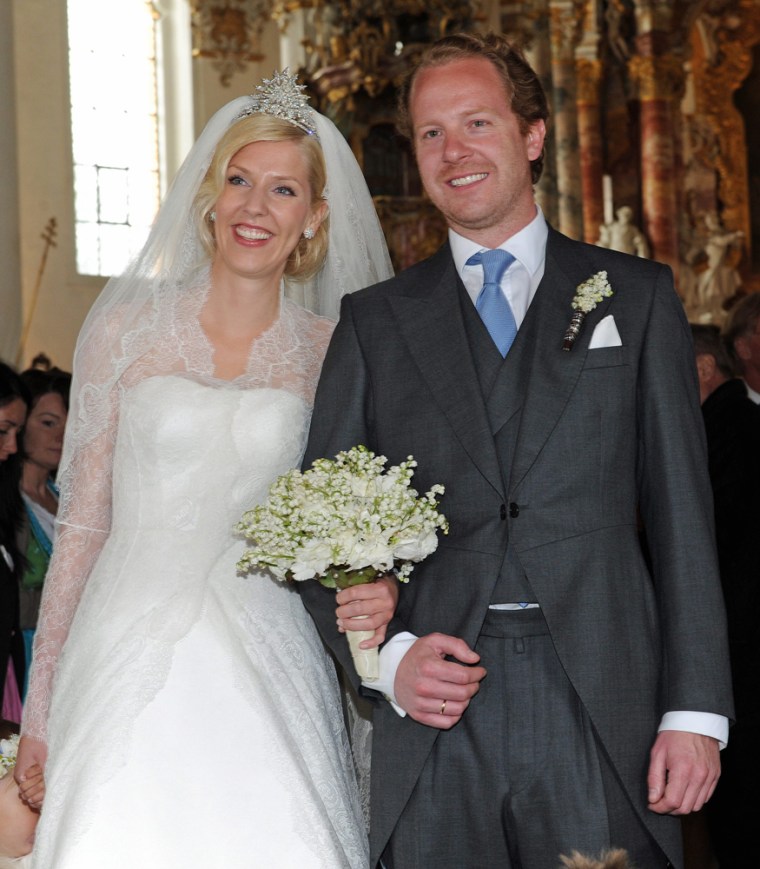 Princess Felipa of Bavaria and Christian Dienst smile after the marriage ceremony. About 500 guests reportedly attended (smaller than a U.K. royal wedding, but still a lot of fascinators in attendance).
