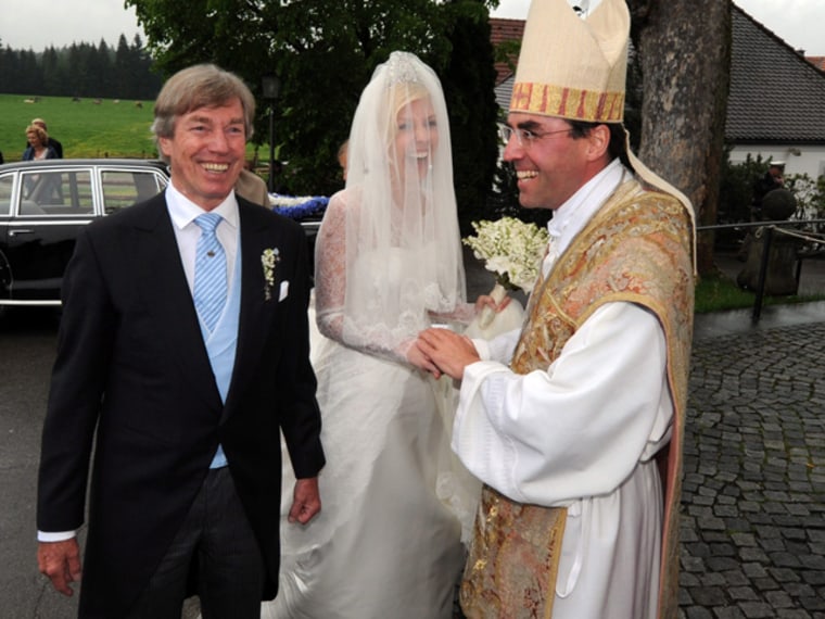 Someone made a funny: Pastor Monsignore Kirchmeier greets the bride, Princess Felipa of Bavaria, and her father, Prince Leopold of Bavaria, prior to t...