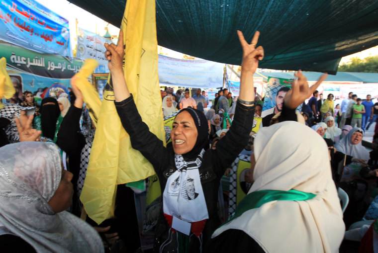 Relatives of Palestinian prisoners on hunger strike flash the victory sign as they celebrate in Gaza City on May 14, 2012 after hearing that the prisoners have agreed a deal with Israel to end their fast in exchange for an easing of their conditions. Most of the 1,550 prisoners on hunger strike have been fasting for up to 28 days to demand an improvement in their conditions, but another seven prisoners have been refusing food for between 53 and 76 days.