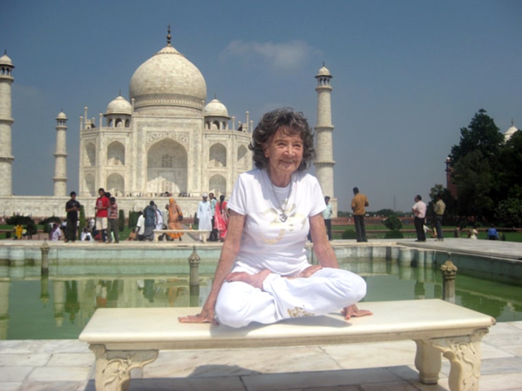 Tao Porchon-Lynch in an elevated lotus position at the Taj Mahal.