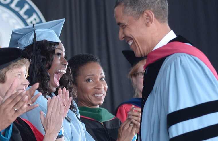 President Barack Obama greets a graduate before making the commencement address at Barnard College on May 14 in New York.