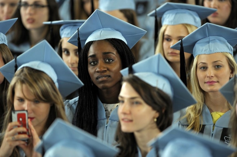 Graduates listen to Barack Obama give the commencement address at Barnard College in New York City.