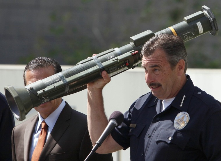 Los Angeles Police Chief Charlie Beck holds up a rocket launcher taken as part of a cache of weapons received as part of a weekend gun buyback program at Los Angeles Police headquarters in Los Angeles on Monday, May 14, 2012. The haul also included 791 handguns, 527 rifles, 302 shotguns, marking a four-year low. A local supermarket chain donated $200,000 in gift cards to give out in exchange for the guns.