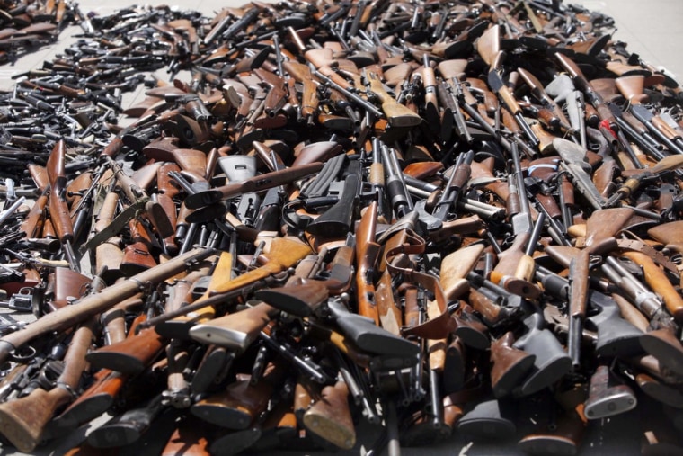 A pile of guns is displayed at a news conference after an annual Gun Buyback Program which netted 1,673 firearms over the weekend, marking a four-year low shown at the Los Angeles Police headquarters in Los Angeles.