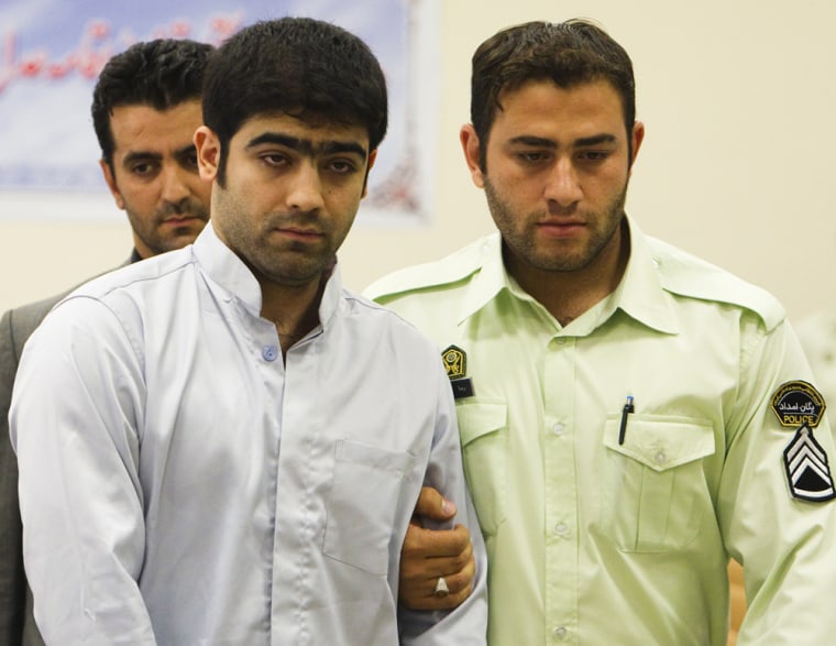 Majid Jamali Fashi, left, appears at his trial at the revolutionary court in Tehran on August 23, 2011.