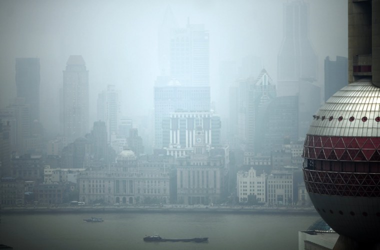 A view of the Oriental Pearl TV Tower, right, and downtown Shanghai seen through the haze on May 15, 2012.