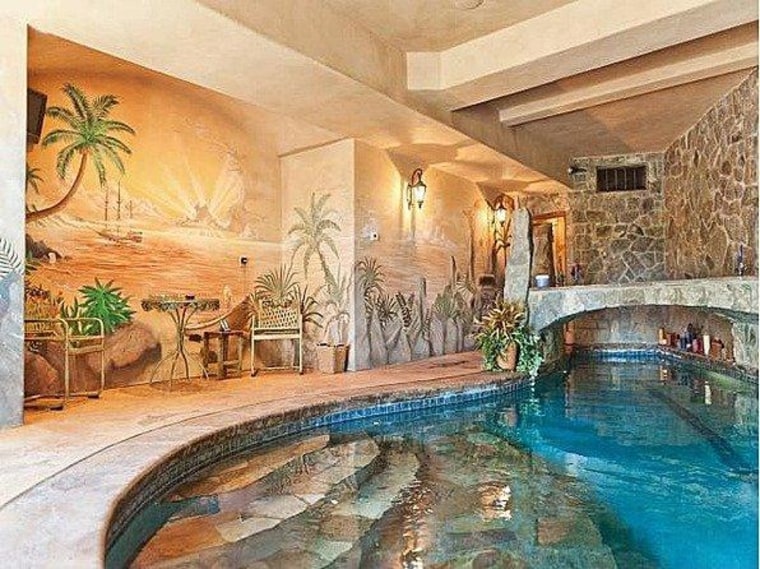 A stone bridge is the only way into the indoor pool area.