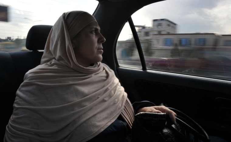 Afghan cardiologist Rahima Stanikzair, 43, travels to her private clinic after finishing work at the French Medical Institute for Children (FMIC) in Kabul on May 13, 2012.