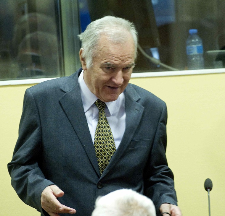 Former Bosnian Serb army commander Ratko Mladic attends his trial at the International Criminal Tribunal for the former Yugoslavia (ICTY) at The Hague May 16, 2012. Mladic, 70, appeared on Wednesday for his genocide trial looking confident, flashing a thumbs-up and clapping his hands as he entered the courtroom.