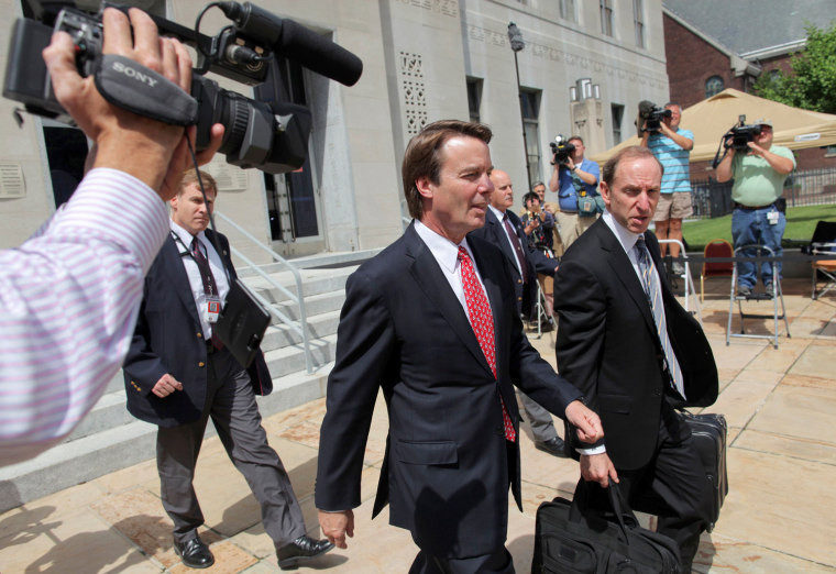 John Edwards exits a federal courthouse next to one of his defense lawyers, Abbe Lowell (R) in Greensboro, North Carolina May 10, 2012. Edwards, 58, is accused of secretly soliciting more than $900,000 in illegal campaign funds from two wealthy donors to hide his pregnant mistress during his failed bid for the 2008 Democratic presidential nomination.
