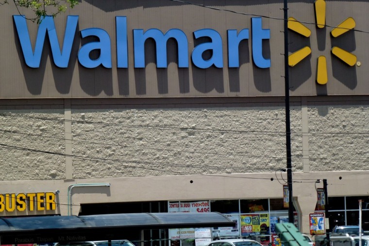 View of a facade of a Wal-Mart supermarket. Wal-Mart posted better-than-expected quarterly profit.