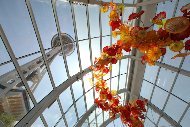 The Space Needle is seen through the walls and ceiling of the