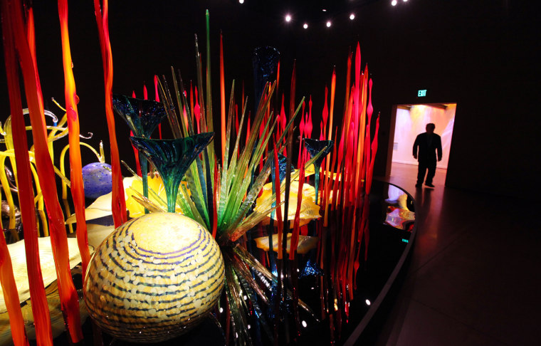 Dale Chihuly is seen silhouetted in the entryway to the