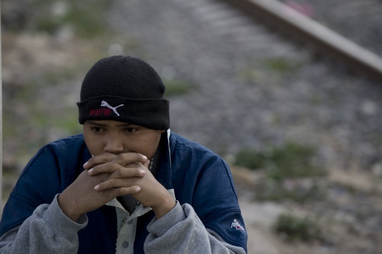 A Central American immigrant waits for a chance to board a train in Tultitlan on May 17, 2012.