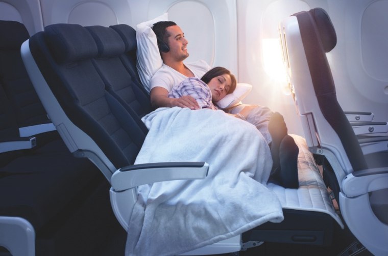 Air New Zealand's Skycouch converts a row of three seats into a bed with the touch of a button. Two passengers can snuggle horizontally, leaning against the wall or lying flat. Pay a standard fare for each seat, and the third shared berth is half price.