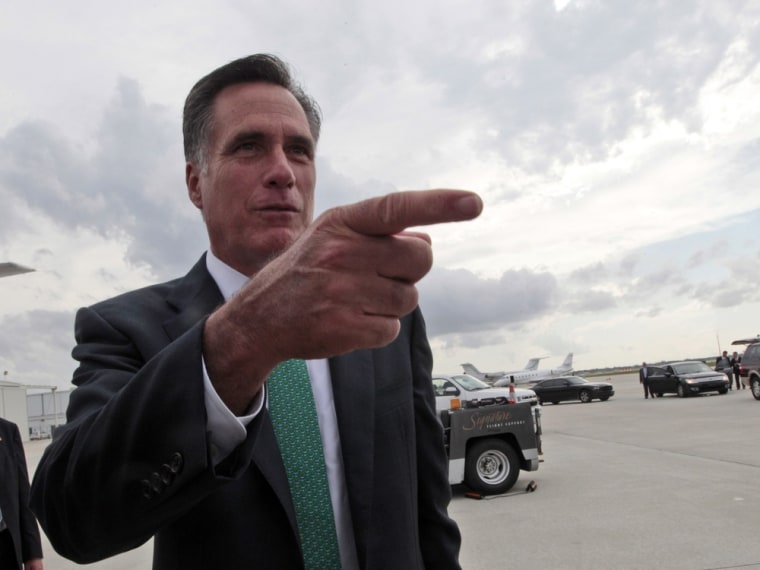 Republican presidential candidate, former Massachusetts Gov. Mitt Romney, gestures while speaking to reporters on the tarmac after arriving in West Palm Beach, Fla., Thursday, May 17, 2012.