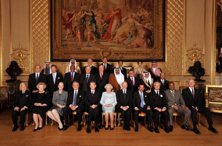 Queen Elizabeth II poses for a group photo with her royal guests in the Grand reception room at Windsor Castle.