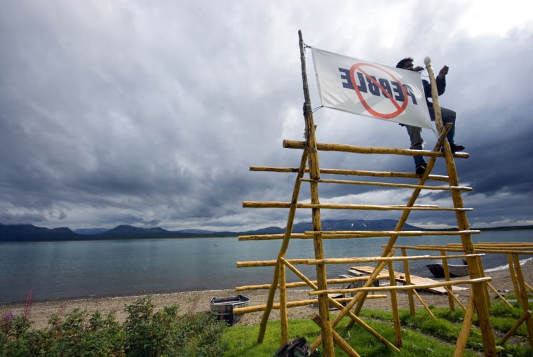 Many in native communities like Nondalton, Alaska, are among those opposed to the Pebble Mine project. A protest banner is hung on a newly built fish drying rack.
