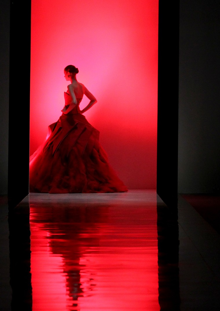 A model walks the runway at the Audi Fashion Festival Show of American fashion designer Zac Posen's Pre-Fall & F/W 2012 collection on May 19, in Singapore. The annual fashion festival showcases works of top and emerging designers as part of efforts to promote the city-state as a fashion hub.