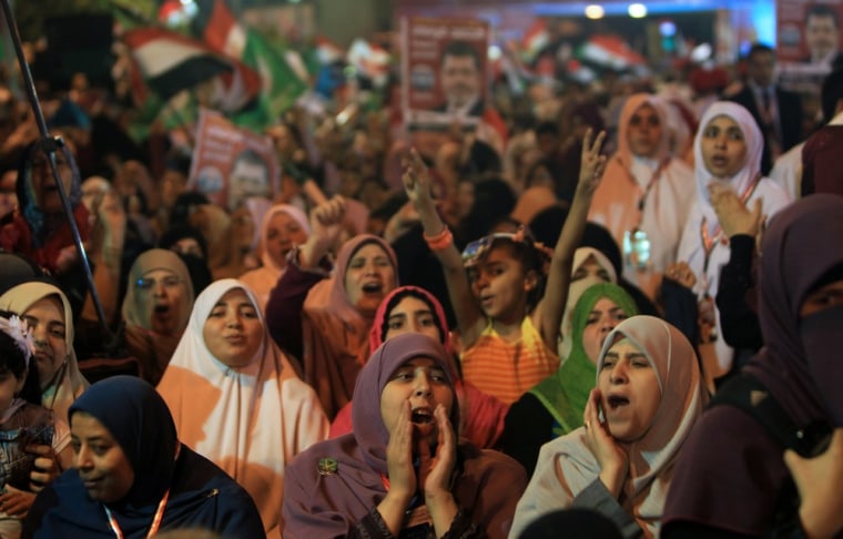 Supporters of Mohammed Mursi attend the party's last campaign rally in Cairo on May 20, 2012.