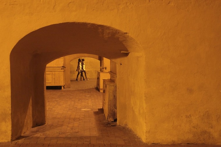 Prostitutes walk on the square of the old city in Cartagena, Colombia.