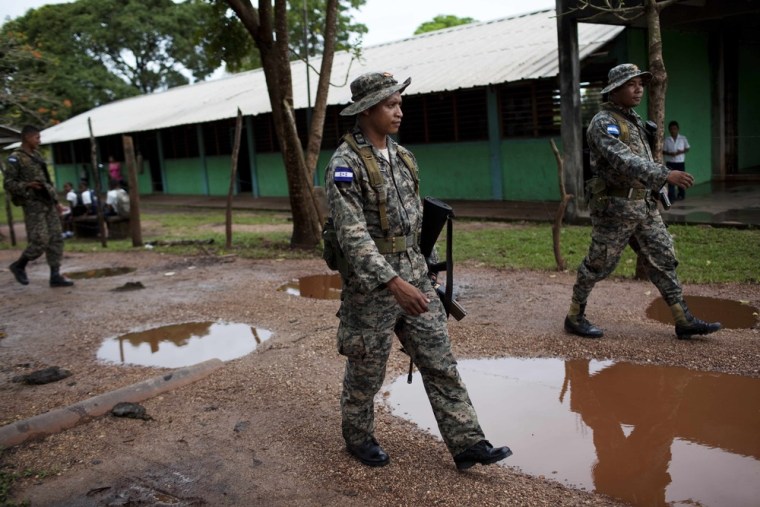 Honduran soldiers patrol in Ahuas on May 22, 2012. Following the raid on May 11 Honduran police narcotics forces and men speaking English spent hours searching the small town for a suspected drug trafficker, according to villagers.