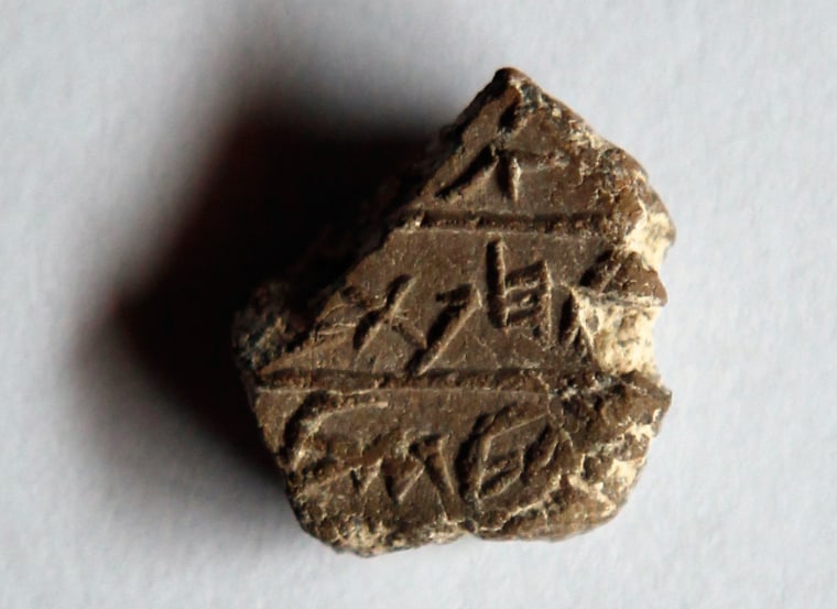 The tiny clay seal is imprinted with three lines of ancient Hebrew script that include the word