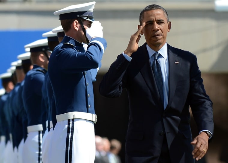 President Barack Obama salutes as he arrives to deliver commencement address at the U.S. Air Force Academy in Colorado Springs, Colo. on May 23.