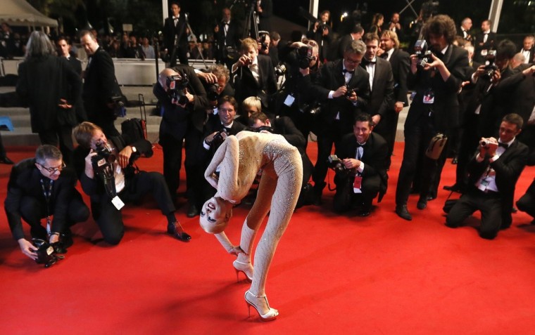 A contortionist performs on the red carpet in front of photographers ahead of the screening of 'Holy Motors' during the 65th Cannes Film Festival, in Cannes, France, on Wednesday. The movie is presented in the Official Competition of the festival, which runs from 16 to 27 May.