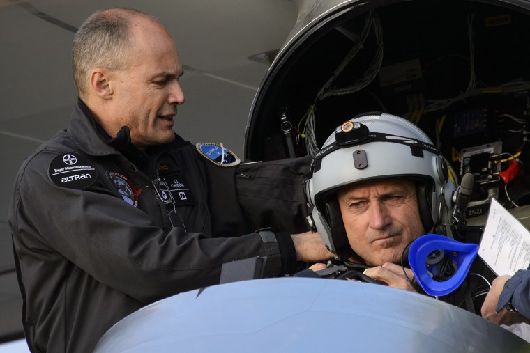 The president of the Swiss sun-powered aircraft Solar Impulse project, Bertrand Piccard, helps pilot Andre Borschberg prepare for takeoff on May 24, in Payerne on its first attempted intercontinental flight from Switzerland to Morocco.