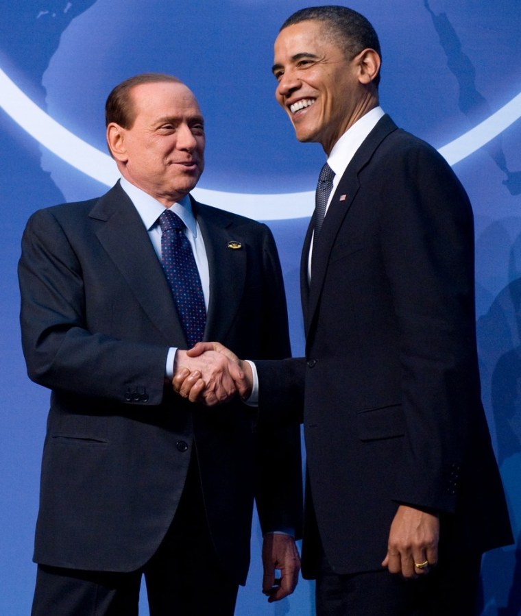 US President Barack Obama (right) greets the President of Italy Silvio Berlusconi upon his arrival for dinner during the Nuclear Security Summit at the Washington Convention Center in Washington in 2010.
