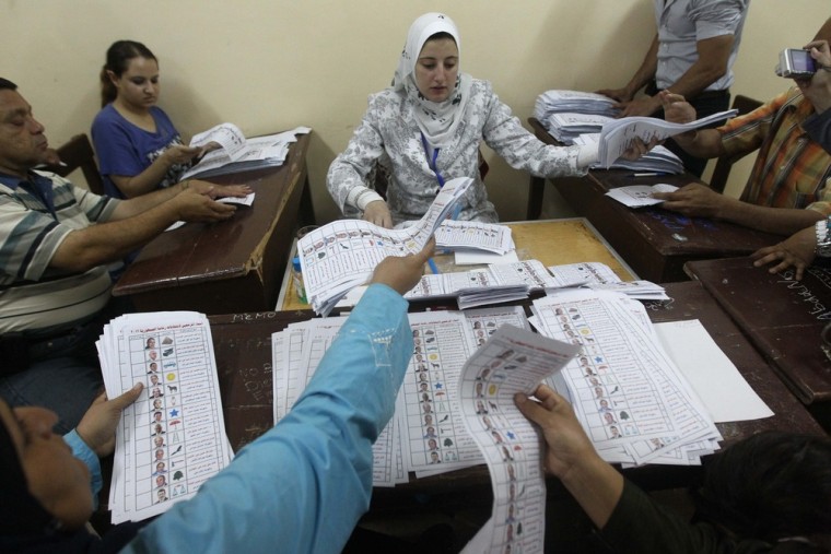Egyptian election officials count ballots at a polling station in Cairo on May 24, 2012 after polls closed in the country's landmark presidential election. Around 50 million eligible voters were called to cast their ballots in 13,000 polling stations around the country. AFP PHOTO / KHALED DESOUKIKHALED DESOUKI/AFP/GettyImages