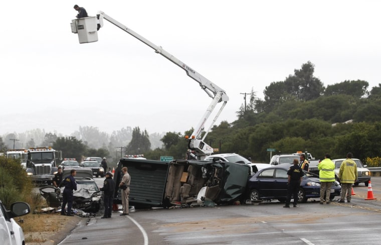 Investigators study the scene of a three vehicle crash on a rural highway in which four people were killed and three injured on Friday in Poway, Calif.  The Chevy Silverado was speeding northbound on State Route 67 between Poway and Ramona in damp, misty conditions when the driver apparently lost control, crossed into oncoming traffic.
