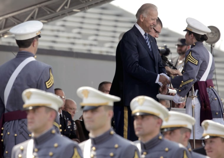 Vice President Joe Biden hands a West Point graduate her a diploma on Saturday.