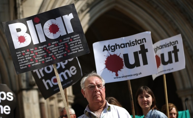 Heckler calls Tony Blair 'a war criminal' as former British PM appears