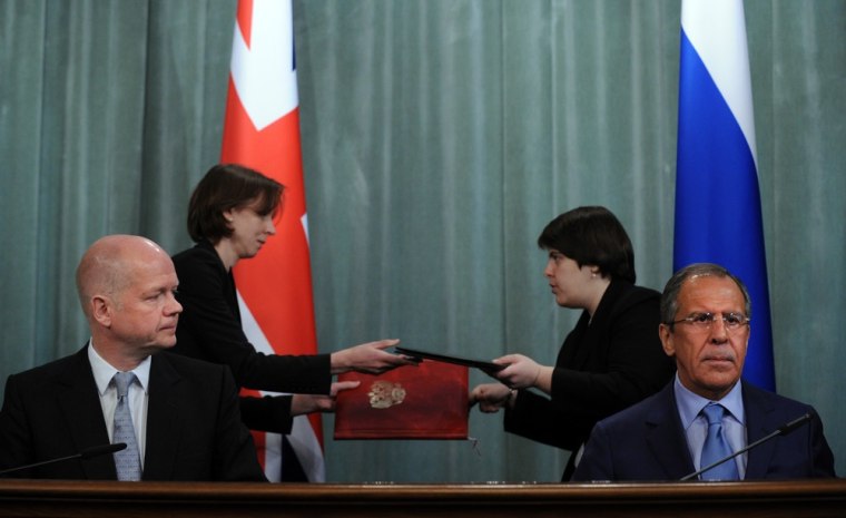 Visiting British Foreign Minister William Hague (L) looks at Russian counterpart Sergei Lavrov during their meeting on Syria in Moscow on Monday.