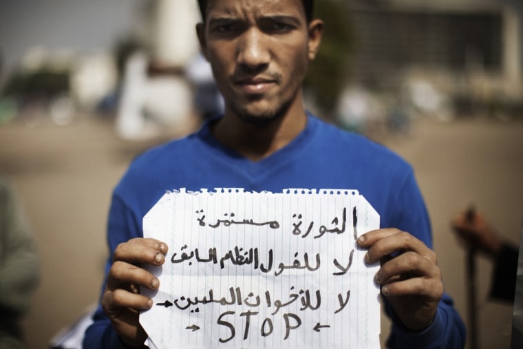 A man demonstrating in Cairo's Tahrir square on May 29. His sign reads: