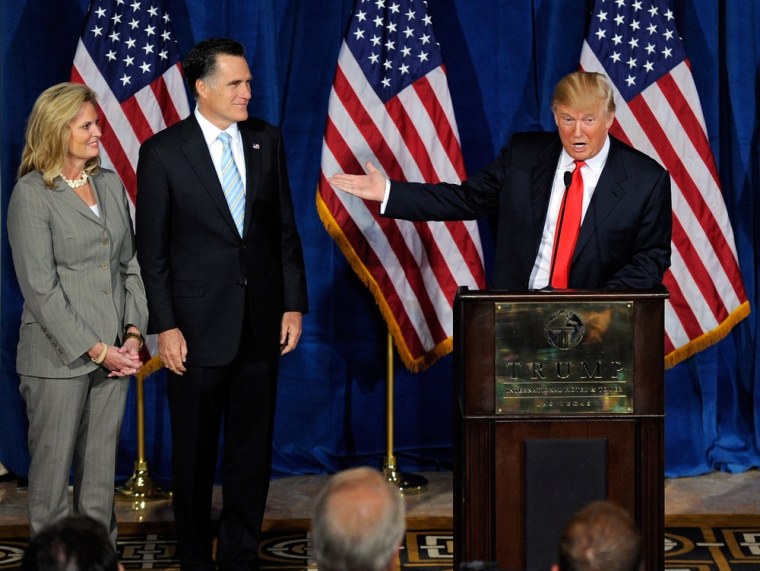 Ann Romney and Republican presidential candidate, former Massachusetts Gov. Mitt Romney, look on as Donald Trump endorses Mitt Romney for president during a news conference at the Trump International Hotel & Tower Las Vegas February 2, 2012.