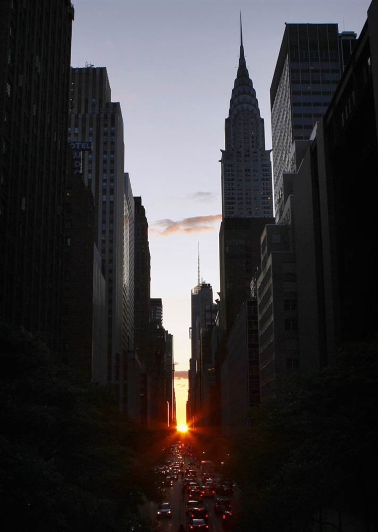 The sun shines down 42nd Street below the landmark Chrysler Building at sunset on July 12, 2009, during Manhattanhenge.