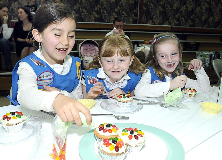 Magnolia Scott, left, Alivia Whitlock and Hannah Beeson, troop 2578, Divide Elementary School students in Lookout W.V., participate in the Girl Scout Regional Cupcake Challenge held at Crosspoint Church in Beckley, W. Va.