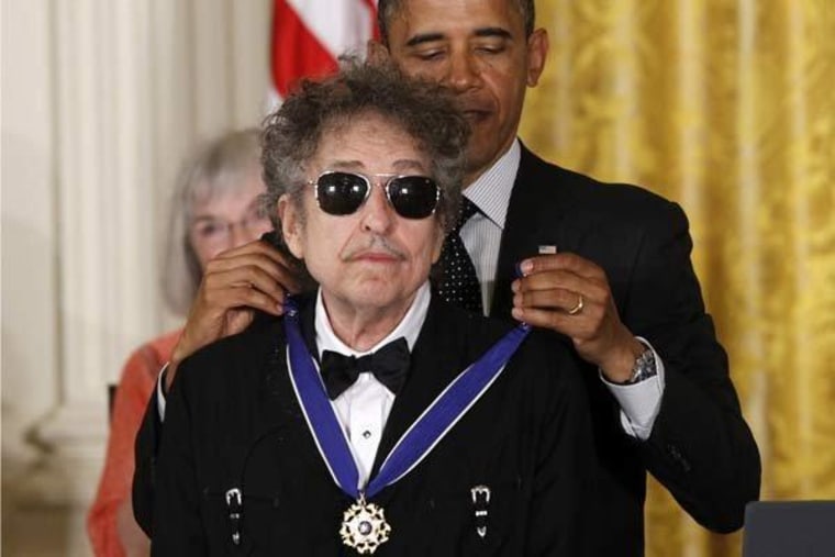President Obama presenting sunglasses-clad Bob Dylan with a Medal of Freedom on Tuesday at the White House.