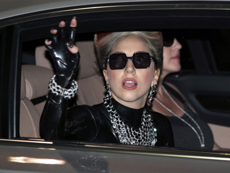 Lady Gaga greets Thai fans as she arrives at Don Muang Airport in Bangkok, Thailand.