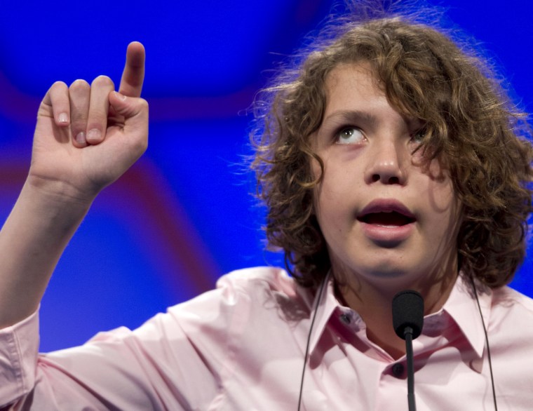 Sam Lowery, of Charlestown, Mass., spells his word in the air during round two of the National Spelling Bee, Wednesday, May 30, in Oxon Hill, Md.