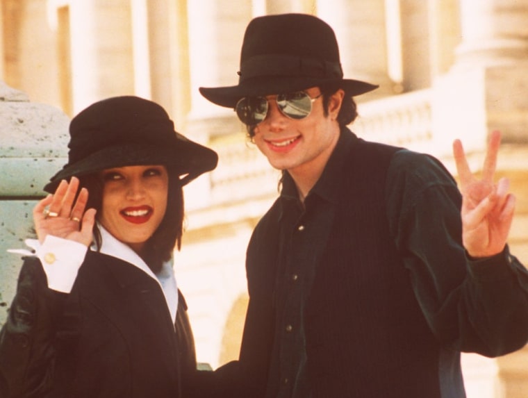 Pop star Michael Jackson and his wife Lisa Marie Presley wave to photographers as they visit the Versailles castle near Paris in 1994.