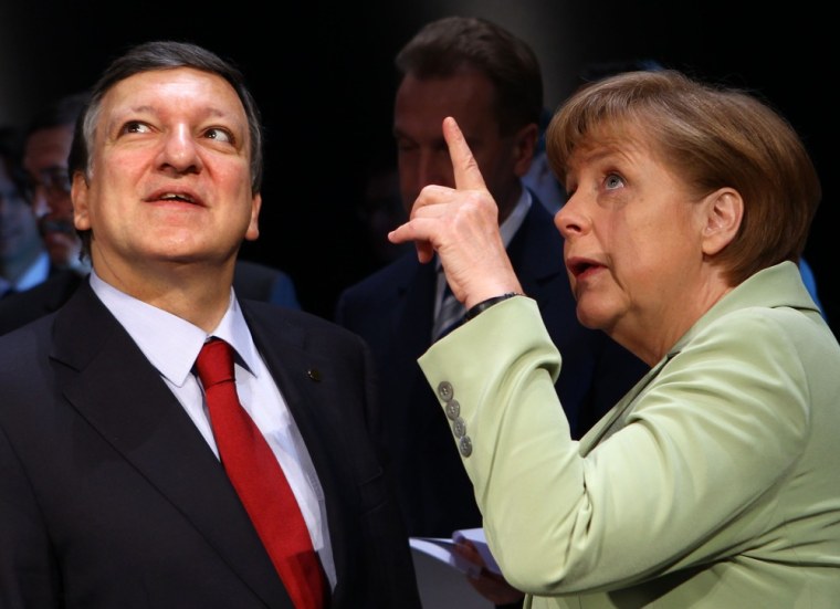 German Chancellor Angela Merkel speaks with European Commission President Jose Manuel Barroso at the summit opening.