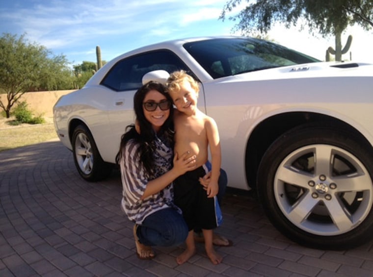 Bristol Palin and her son Tripp and the car she is selling.