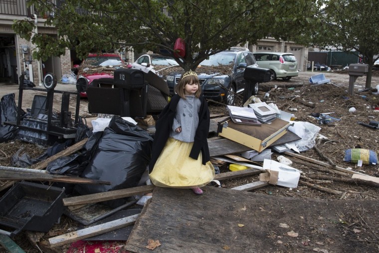 Lisa Kravchenko stands amongst flood debris in her princess Halloween costume on Oct. 31, 2012 in Staten Island.